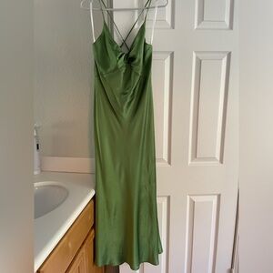 Neon green dress, knot in breast area